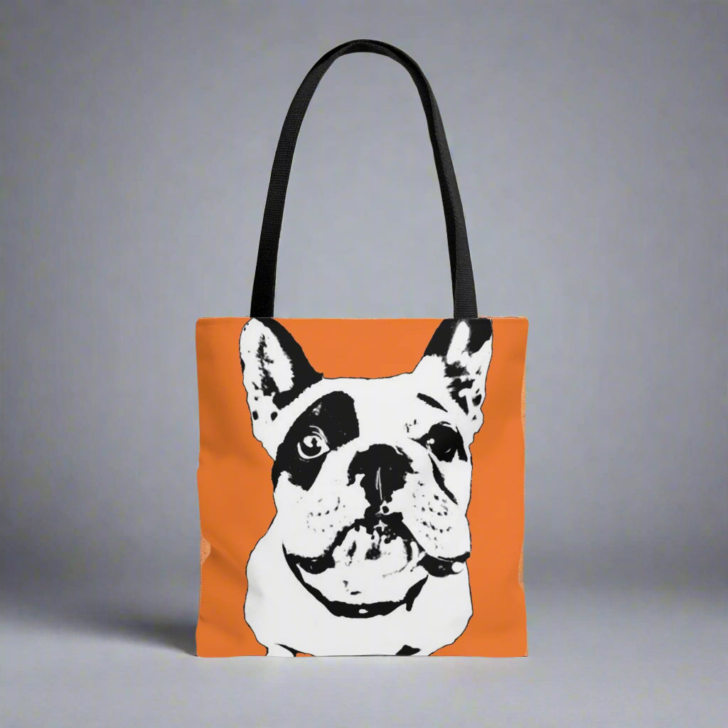 A tote bag with a black handle and an orange fabric featuring Ole Ralphdo
16 x 16